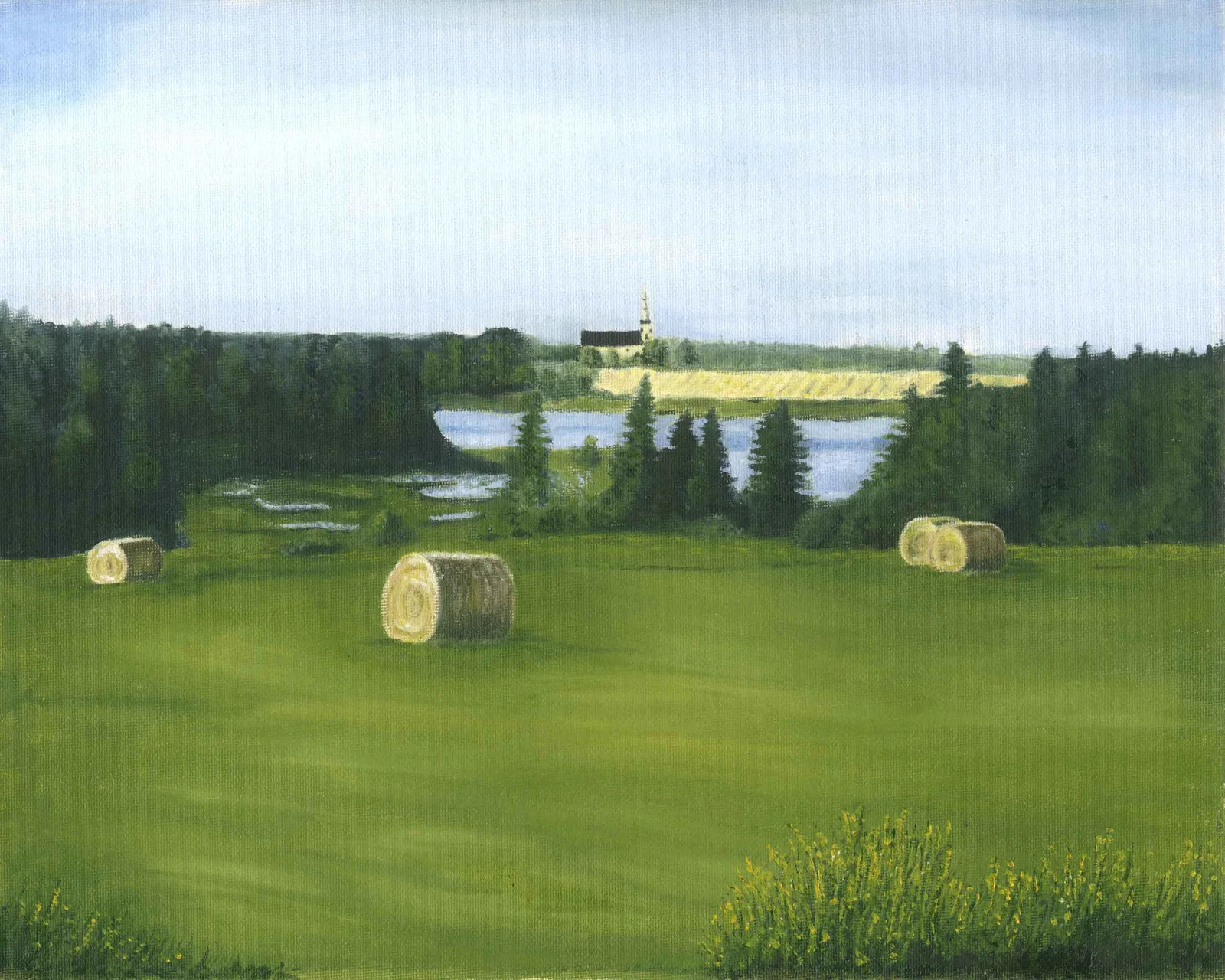 Round bales of hay in the foreground with St. Patricks Church in the background